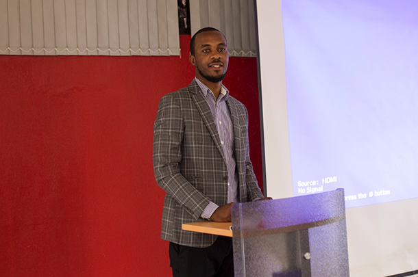 Davy Uwizera presenting in a classroom