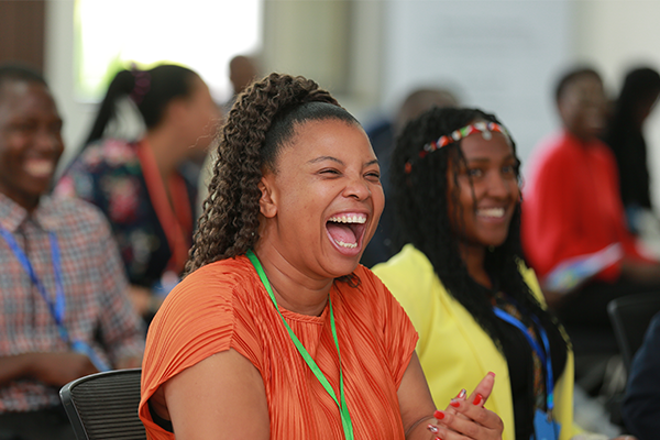 Woman laughing in audience