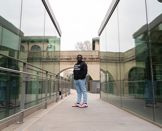 student standing on a bridge