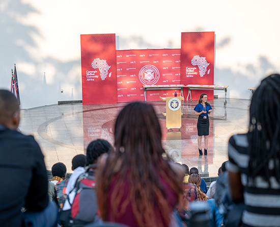 Woman speaking on stage