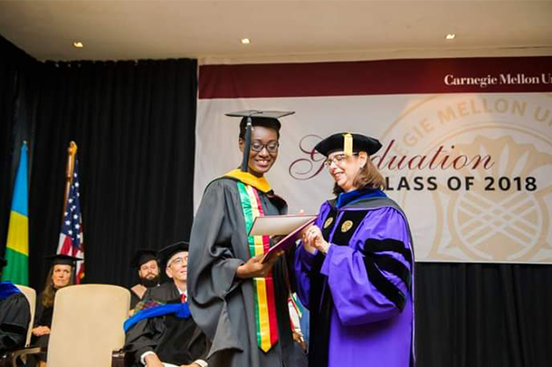 Student on stage receiving diploma
