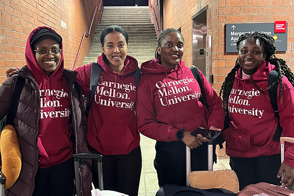 Group photo of students in CMU sweatshirts