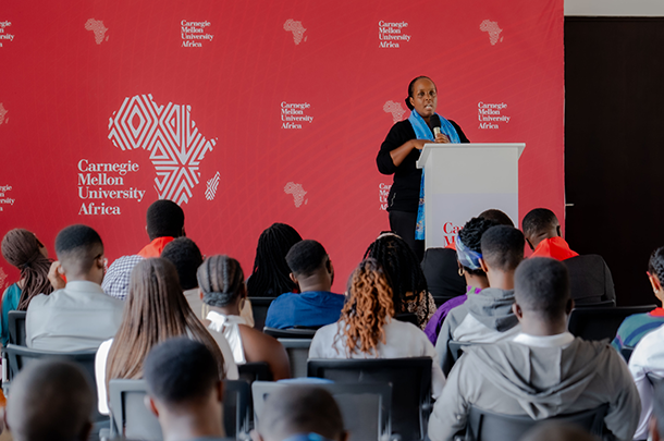 Woman speaking at a podium