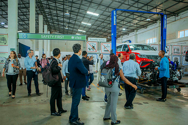 People walking through a garage