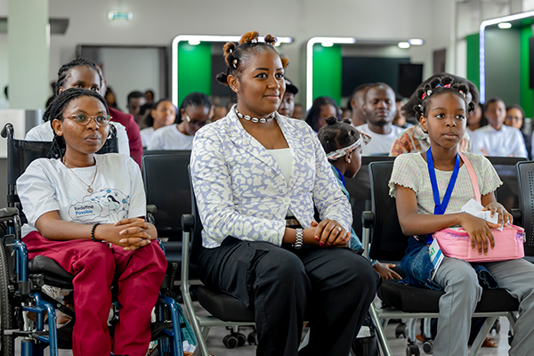 An audience listening to a speaker