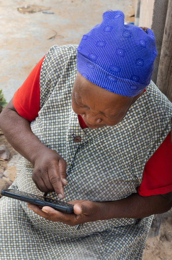 Woman using phone in Africa